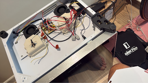 Full guts, cover in hand — same cabinet, different air